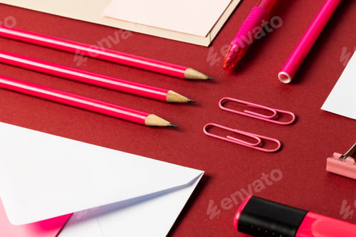 Preview: Flat lay of white papers with copy space and school materials on red background