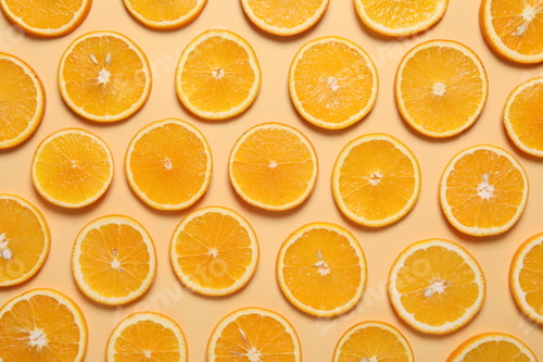 Preview: Slices of juicy orange on beige background, flat lay