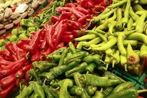 Preview: green and red capsicum displaying at shop