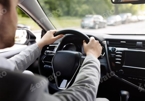 Preview: Personal transport, health care, man driving car, hand on steering wheel, looking at road ahead