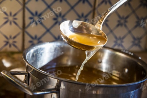 Preview: Broth being ladled from saucepan