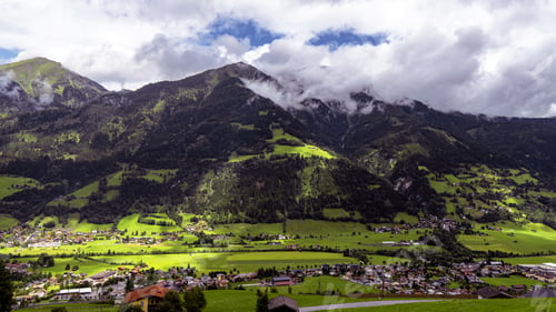 Preview: Beautiful scenery of a mountainous landscape covered with snow under a cloudy sky