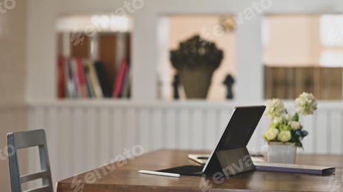 Preview: Digital tablet on wooden table.