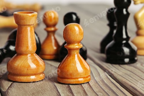 Preview: chess figures on brown woden table background