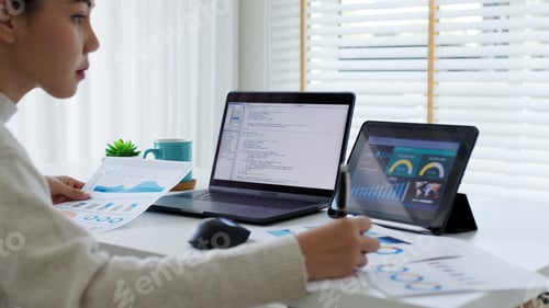 Preview: Back rear view of young asian woman, freelance data scientist work remotely at home