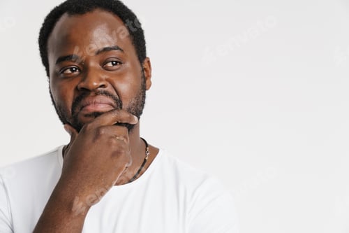 Preview: Black bristle man grimacing while holding his chin