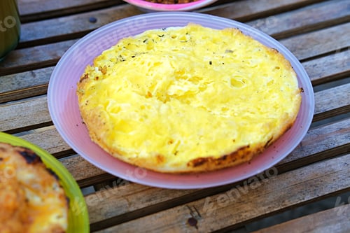 Preview: Traditional Indonesian egg serabi, freshly grilled over an open flame,