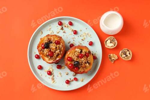 Preview: Concept of tasty food with baked apples on orange background