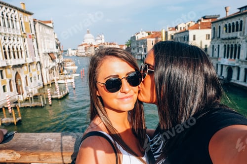 Preview: young women kiss in venice italy