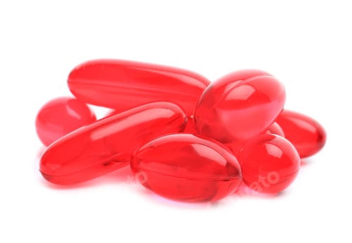Preview: Pile of color pills on white background