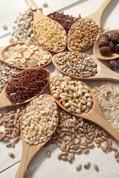 Preview: Cereals In The Spoons On The White Wooden Table Background
