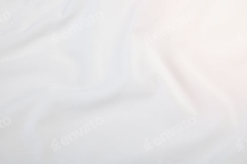 Preview: Top view of freshly ironed white linen sheets, with a subtle texture in the fabric
