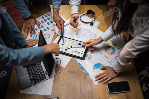 Preview: Multi ethnic brokers analysing financial statistic at office