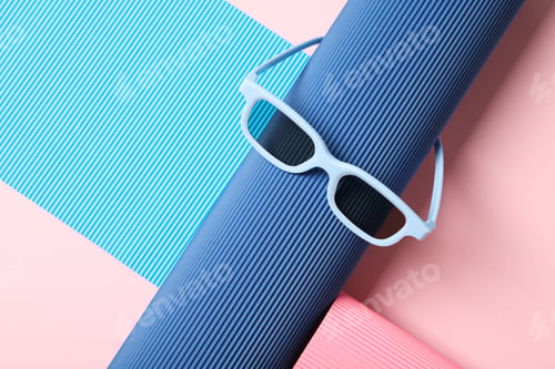 Preview: Blue sunglasses on blue and pink background, space for text