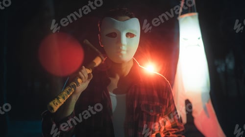Preview: Masked man as concept of fear and terror on Halloween