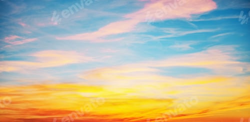 Preview: Sunset with sun and clouds on blue and orange dramatic sky with sun rays