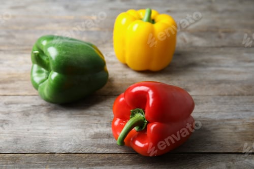 Preview: Raw ripe paprika peppers on wooden background