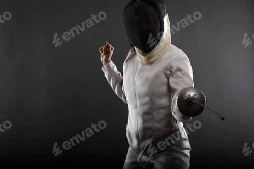 Preview: Portrait of woman wearing white fencing costume practicing with the sword.