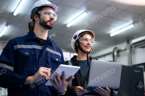 Preview: Engineer mechanician operating and controlling CNC machine
