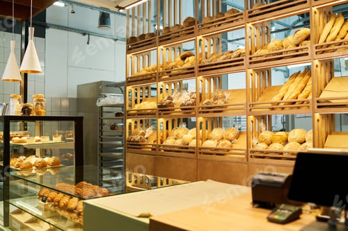 Preview: Worplace of baker with assortment of various pastry and bread on displays