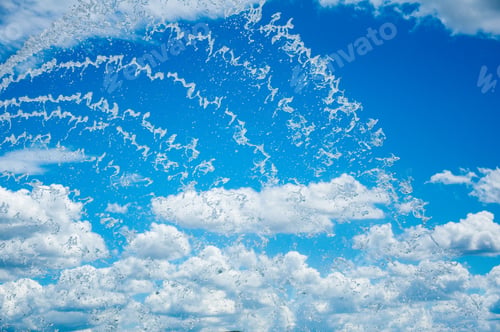 Preview: Lines of cascading water on a blue sky background.