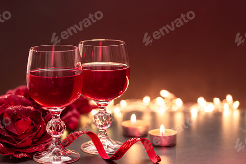 Preview: Background for Valentine's Day with glasses of wine on a blurred background.