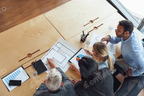 Preview: Top view of professional business managers working with project documents in office