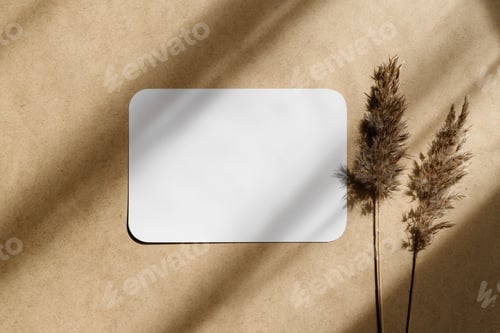 Preview: Top view of blank paper sheet on a beige kraft background with dry grass