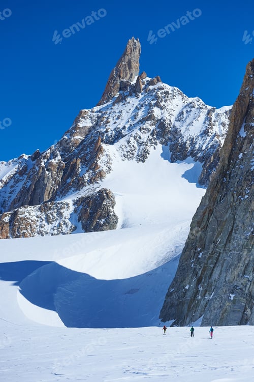 Preview: Distant view of three skiers on Mont Blanc massif, Graian Alps, France