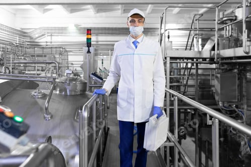Preview: man in mask and robe with a briefcase in hand standing on a Factory dairy products