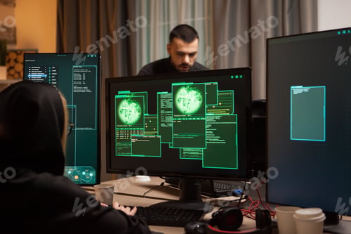 Preview: Back view of female hacker writing a malicious malware
