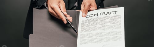 Preview: cropped view of african american businessman showing contract on dark background, panoramic shot