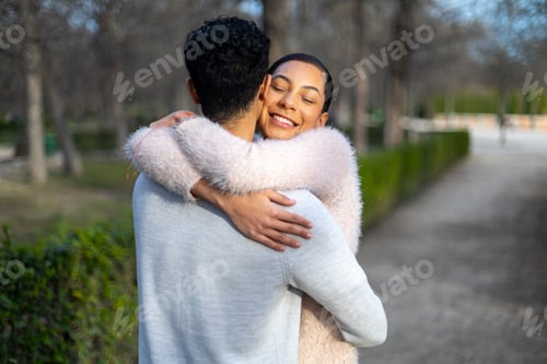 Preview: Happy couple embracing in park, expressing love and affection