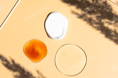 Preview: Cosmetic Serums and Moisturizer Samples on Background