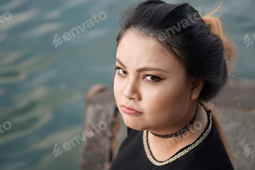 Preview: grumpy young asian woman