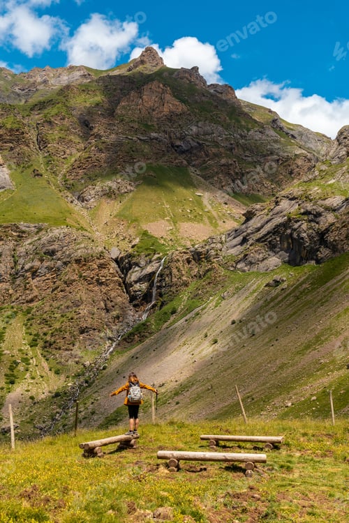 Preview: A young hiker with a backpack at the Salto de Tenendera waterfall viewpoint, Ripera Valley