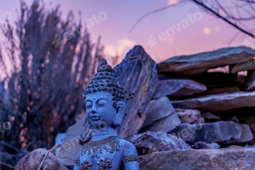 Preview: Serene Buddha statue set against a tranquil sunset background