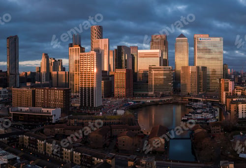Preview: Sunset over the city skyline with reflections on skyscrapers