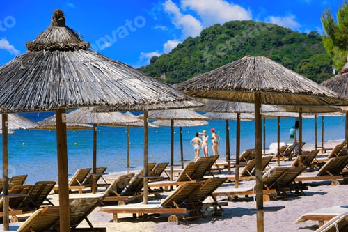 Preview: tourists enjoy the sun and the sea on a Greek beach, Skiathos, Greece