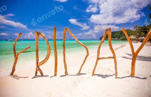 Preview: Perfect white sandy beach and turquoise sea on tropical island with wooden letters made Friday word