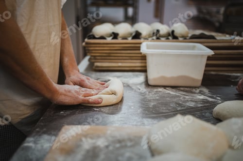Preview: Baker preshpaing bread dough