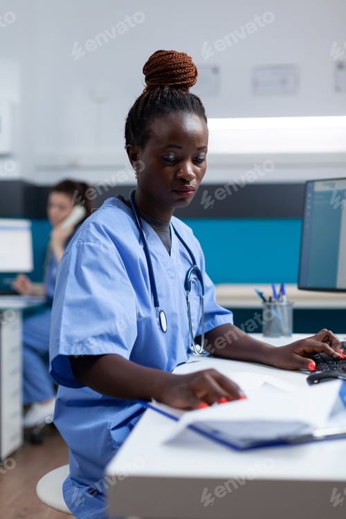 Preview: African american practitioner nurse analyzing sickness expertise