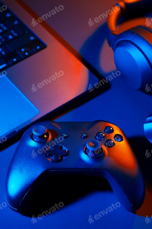 Preview: Headphones, joystick and computer keyboard on black table