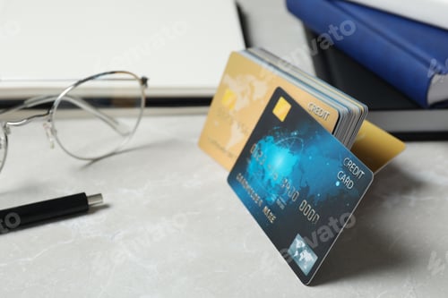 Preview: Many different credit cards on light grey marble table