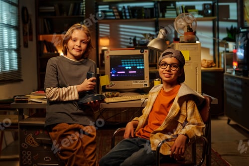 Preview: Smiling Children Holding Retro Video Game Controllers