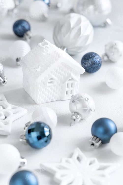 Preview: White toy house with blue, white and silver Christmas decorations