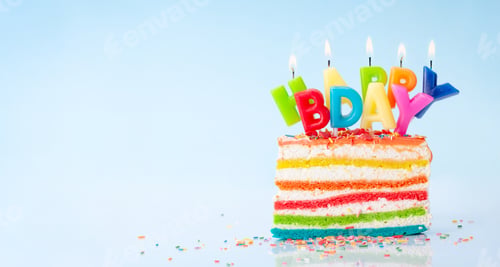 Preview: Birthday cake with burning candles on a blue