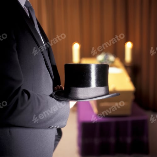 Preview: Undertaker standing in front of a coffin with a top hat in his hand