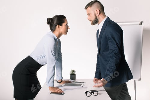 Preview: serious business people having disagreement and looking at each other in office