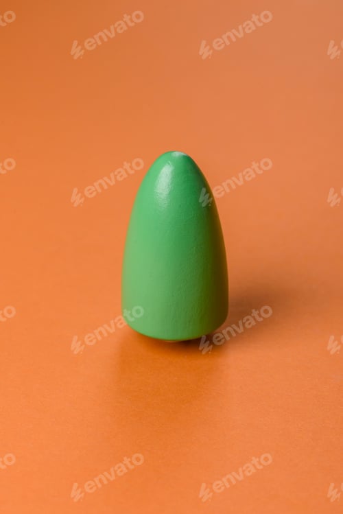 Preview: Wooden model of a tree with a green crown and trunk on a orange background